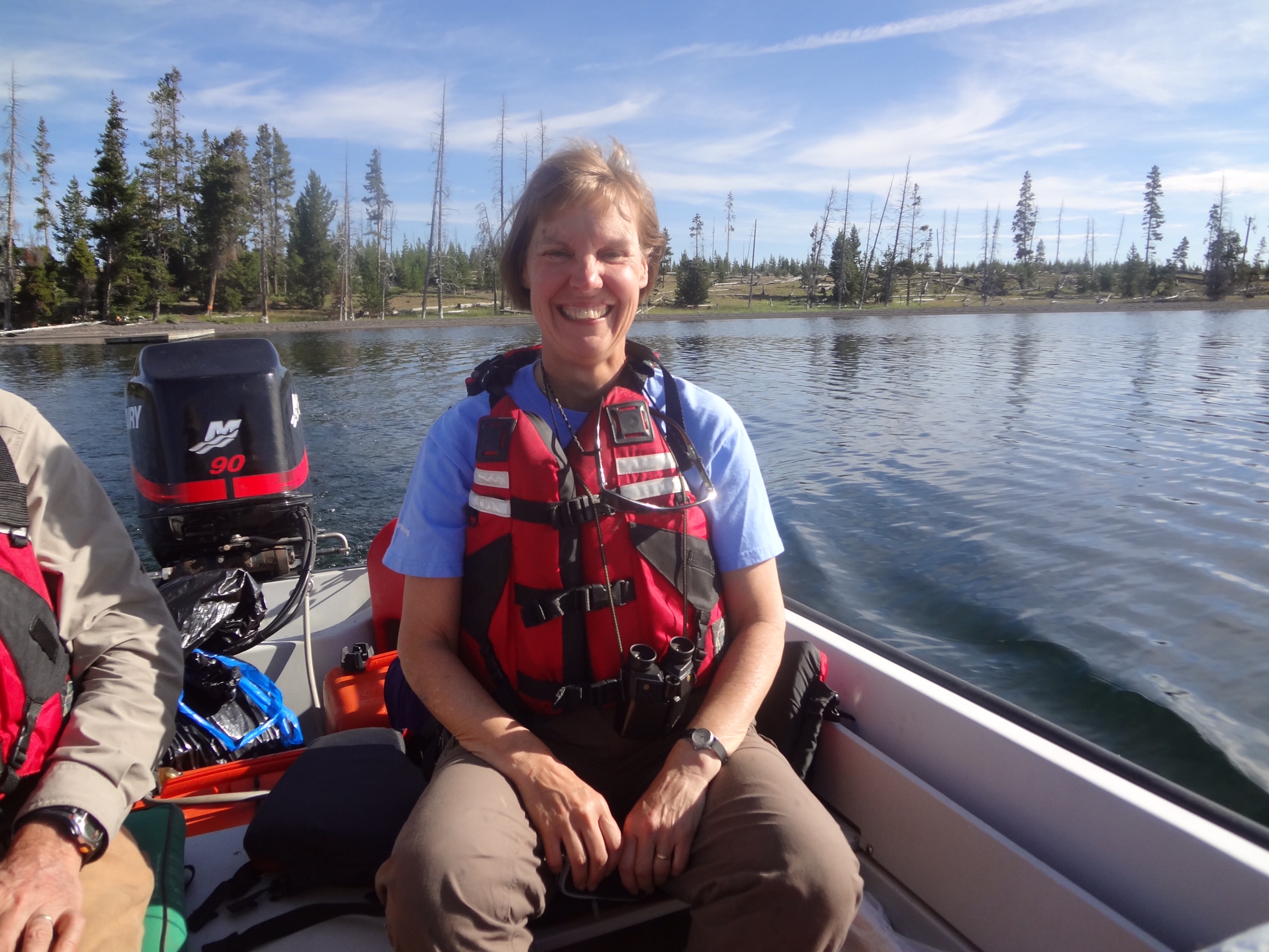 Landscape ecologist Monica Turner travels in her team’s boat, PICO1, across Yellowstone Lake in Yellowstone National Park in July 2012 to access long-term study plots in areas that burned during the 1988 Yellowstone Fires. Named for Pinus contorta, the lodgepole pines that dominate Yellowstone’s forests, PICO1 gets Turner and her group to remote study areas that are more easily reached from the lakeshore. The July trip was part of a major resampling of long-term plots 25 years after the 1988 fires. Turner took over the presidency of the Ecological Society of America in August, 2015, and will serve one year. Credit, Monica Turner.
