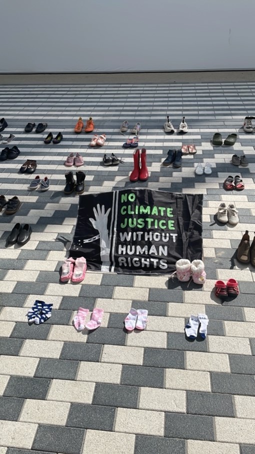 A poster reads: No Climate Justice without Human Rights.