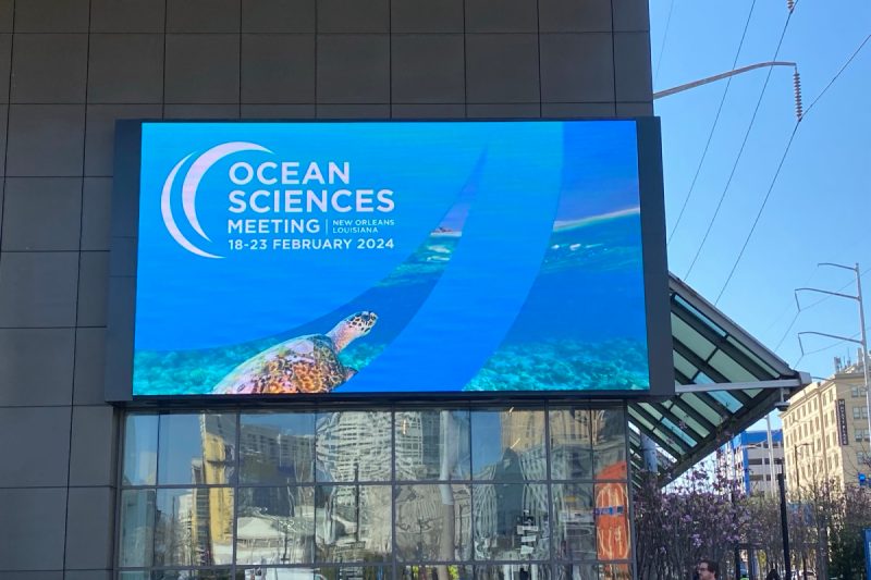 a promotional image for the Ocean Sciences Meeting on the side of the New Orleans Convention Center