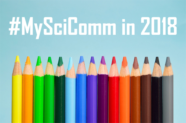 A line of colored pencils, one in each of the common colors on the rainbow spectrum. Text on the image reads "#MySciComm in 2018."