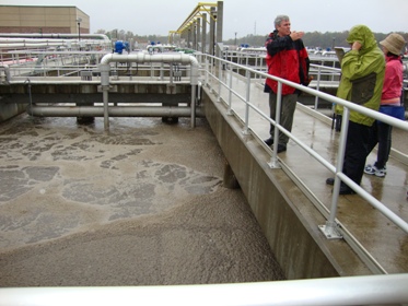 The scum (technical term) that rises to the top of waste water during processes.