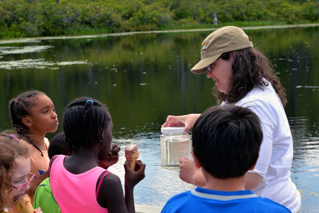 Children learn what zooplankton are, how to collect them, and the role zooplankton play in lake food webs from Leslie Knoll, director of research and education at Lacawac Sanctuary in July 2014. Credit, Jacob Setser Photography.