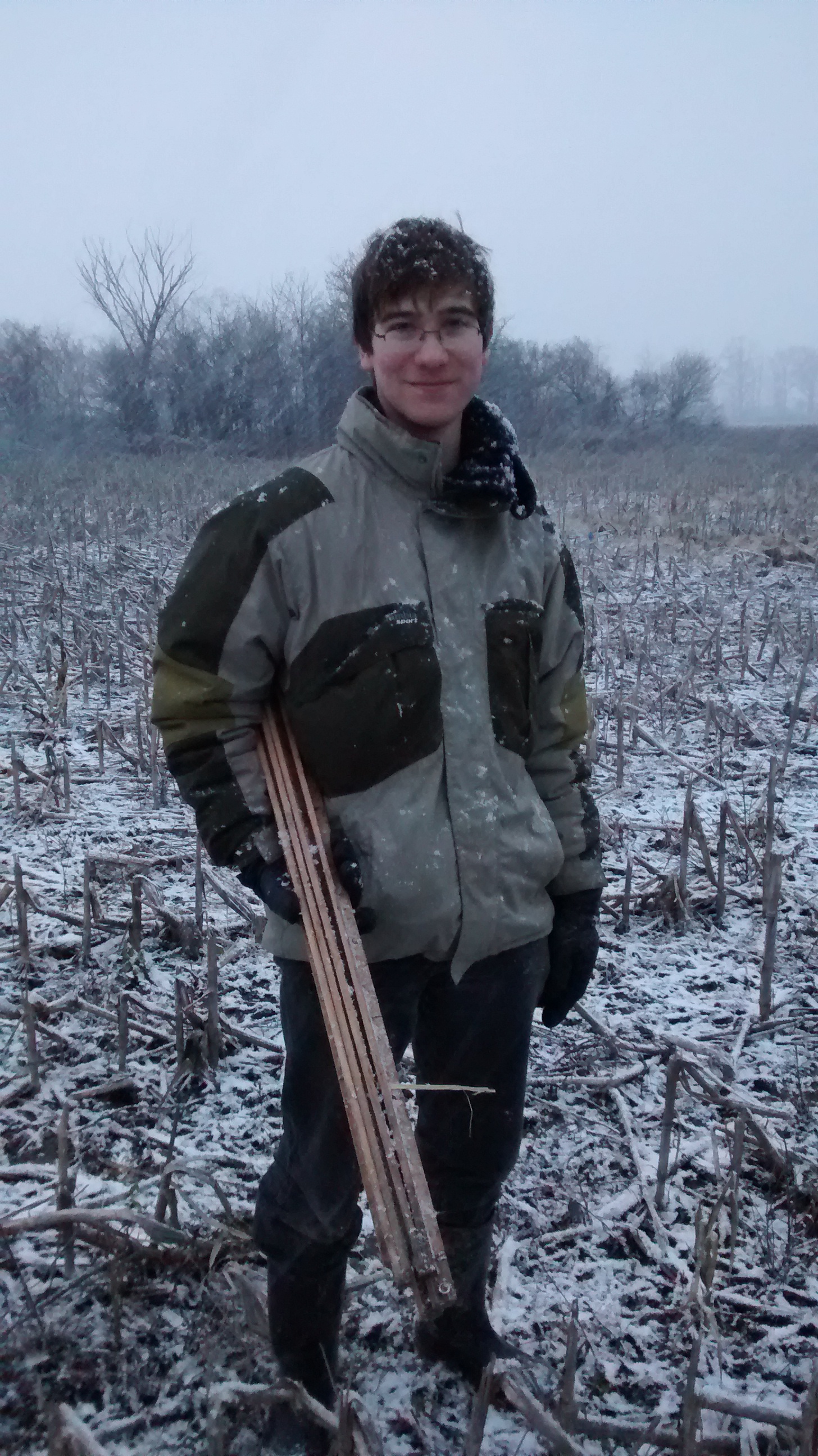 Michael McTavish sets up mulch plots to assess earthworm interactions with soil amendment at Glenorchy Conservation Area, Ontario, Canada, in November 2014. Credit: Heather Cray.