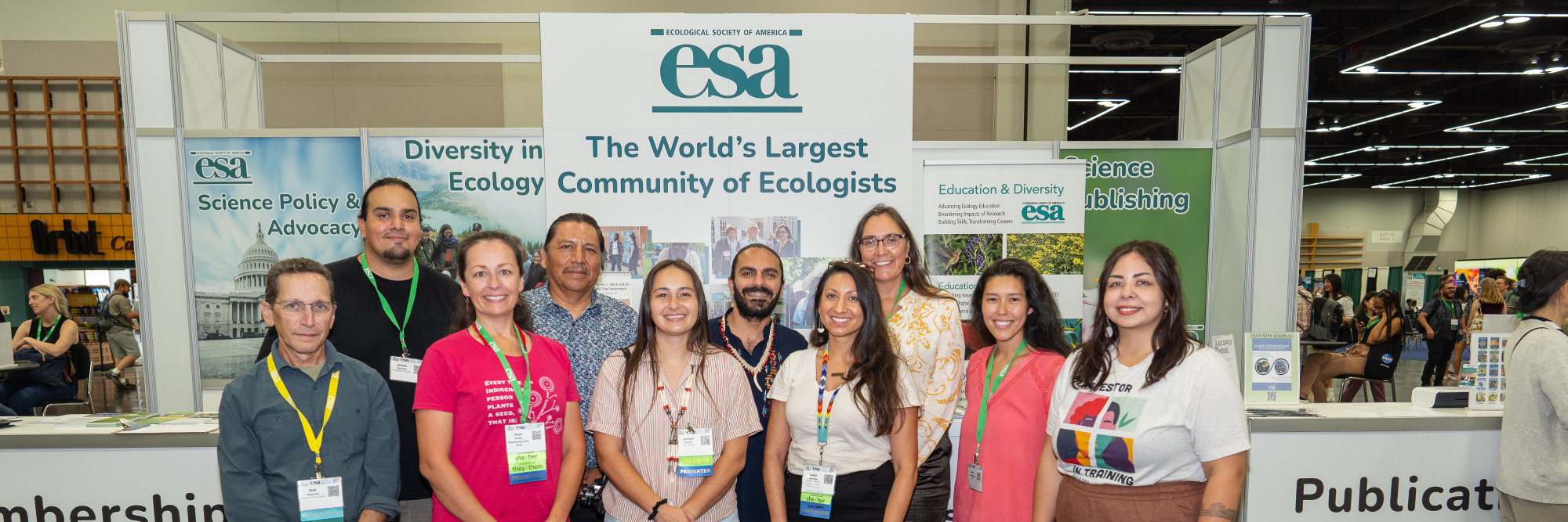 attendees at the 2023 Annual Meeting representing research and practice in traditional ecological knowledge pose in front of the ESA membership booth