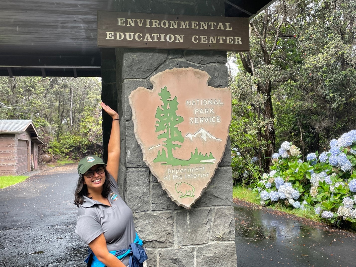 Sana standing by a National Parks Service sign