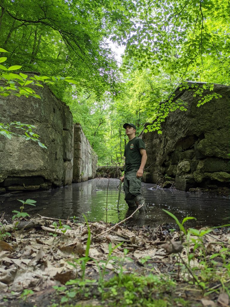 Chris Poling at the base of an abandoned canal.