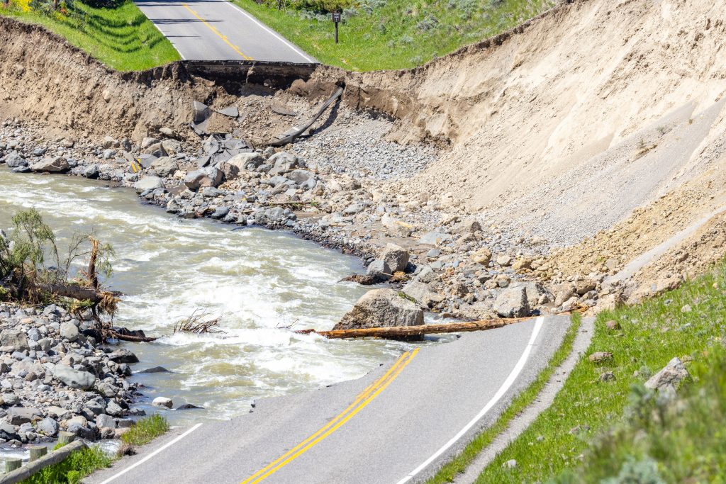 Yellowstone flood event 2022: Northeast Entrance Road washout near Trout Lake Trailhead (14). Road crumbles away due to record high water levels. 