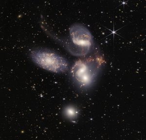 The James Webb image of 5 interacting galaxies. There are many other small light sources in the image, all of which are other galaxies or stars.