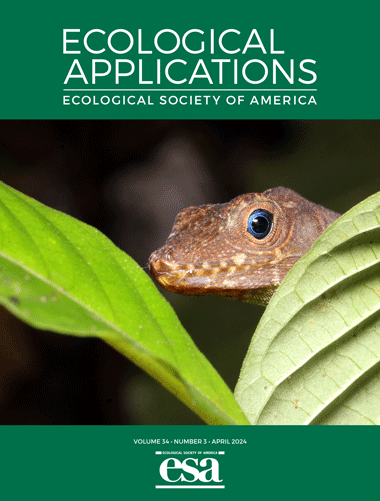 Ecological Applications cover featuring a lizard peeking from behind leaf